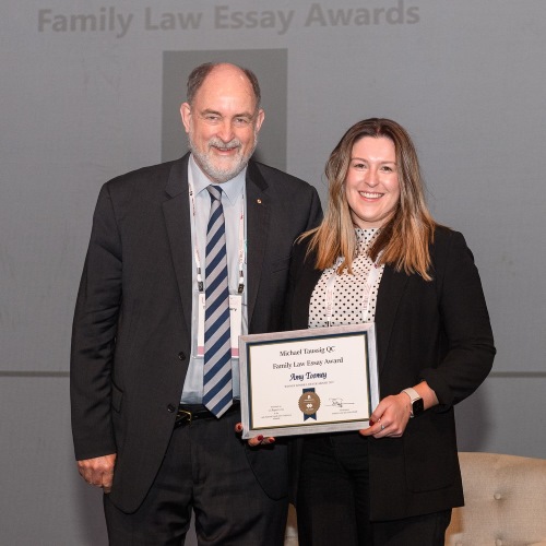 Amy Toomey being presented the 2022 Michael Taussig QC Award by the Hon Gary Watts AM